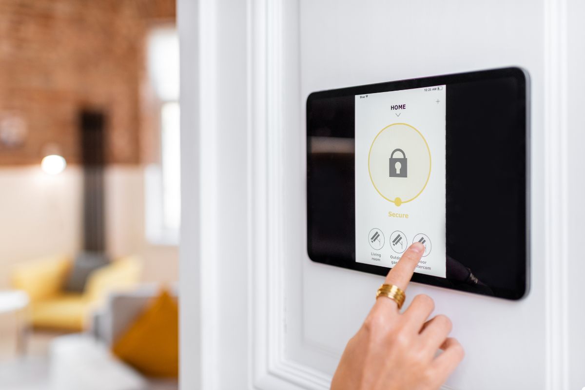 A person interacts with a smart home device, showcasing modern technology in a home environment.
